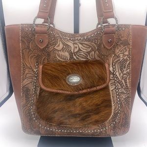 Trinity Ranch, brown cowhide fur, western tooled leather, concealed carry purse.